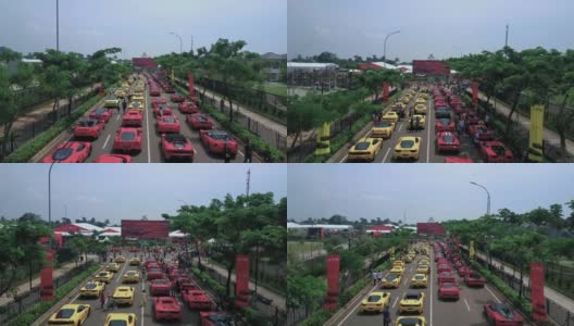 南坦,印度尼西亚。2017年5月03日:一辆名贵跑车在红黄相间的道路上列队飞行的视频片段。拍摄分辨率为4k高清在线视频素材下载
