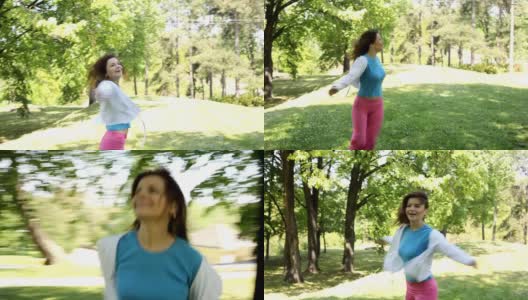 幸福:年轻女子在户外奔跑。高清在线视频素材下载