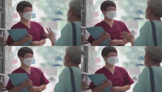 亚裔华裔女护士在诊所向她的女病人讲解体检报告高清在线视频素材下载