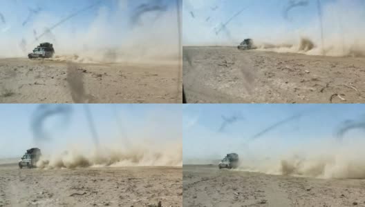 四轮驱动在沙漠上快速行驶，扬起了尘雾高清在线视频素材下载