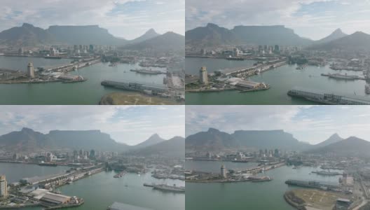 鸟瞰海港及海旁建筑物。市中心的高楼大厦和背景中著名的寓言山。南非开普敦高清在线视频素材下载