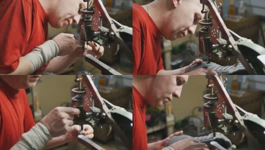 制鞋机将鞋装在机械缝纫机上进行缝制高清在线视频素材下载