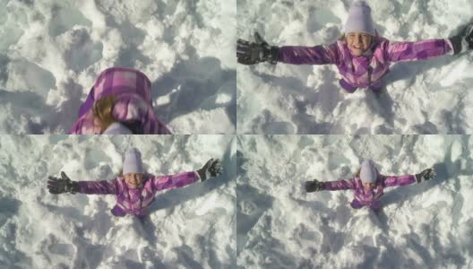 HD CRANE:女孩在雪中玩耍高清在线视频素材下载