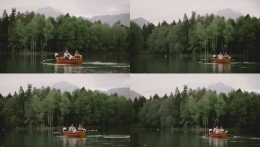 一对新婚夫妇在湖上划船高清在线视频素材下载