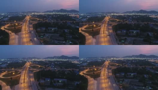 黄昏时分公路交通及炼油厂鸟瞰图高清在线视频素材下载