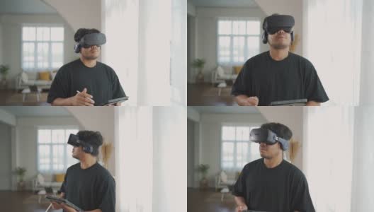 亚洲男子佩戴3D VR眼镜工作，在家享受体验。高清在线视频素材下载