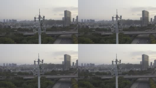 日落时分，城市立交桥旁的5G信号塔高清在线视频素材下载