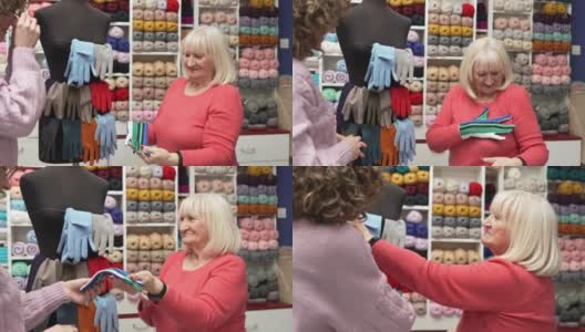 白人年长女顾客在布料店试用手套高清在线视频素材下载