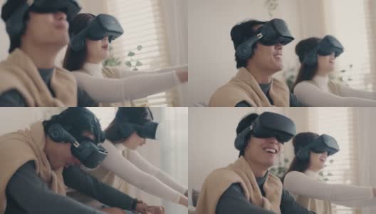 虚拟世界:幸福的亚洲夫妇玩虚拟现实耳机高清在线视频素材下载