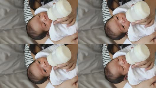 Mother used bottle feeding baby newborn高清在线视频素材下载