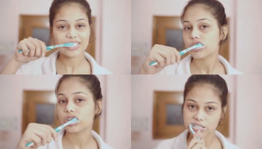 印度年轻的印度妇女正在刷牙。高清在线视频素材下载