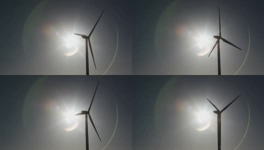 风力涡轮机剪影与太阳和镜头耀斑高清在线视频素材下载