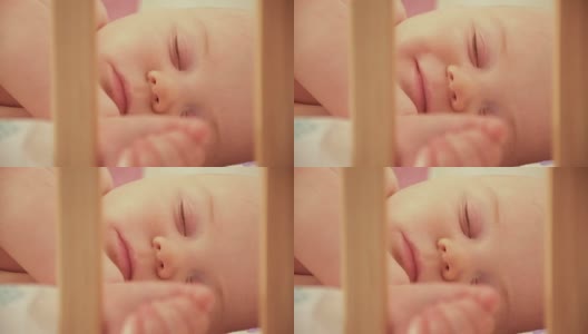 小婴儿在他的婴儿床里睡觉，靠近点高清在线视频素材下载