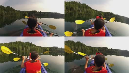 女孩们和宠物狗在湖中划着皮划艇高清在线视频素材下载