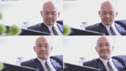 一位在办公室微笑的亚洲商业主管高清在线视频素材下载