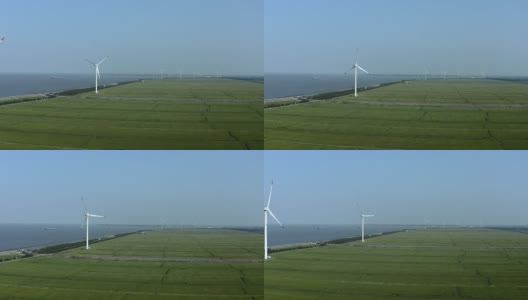 鸟瞰图，风力涡轮机和广阔的稻田在海滩上高清在线视频素材下载