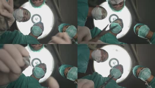 一群外科医生在看着病人高清在线视频素材下载