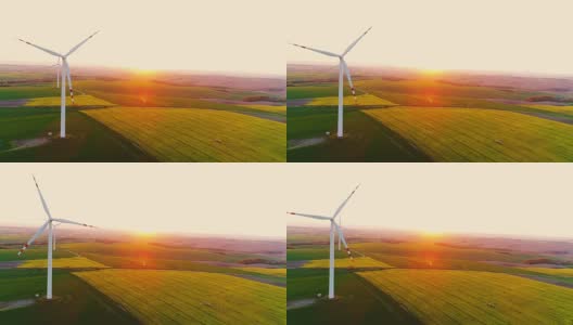 日落时风车涡轮机的无人机视图。高清在线视频素材下载