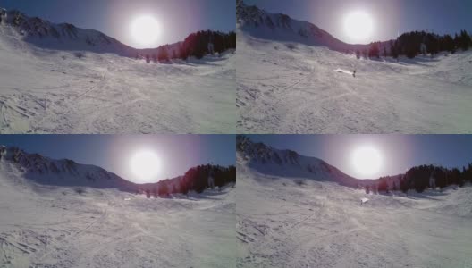 滑雪板女运动员走近相机，刹车并在镜头前撒雪。高清在线视频素材下载
