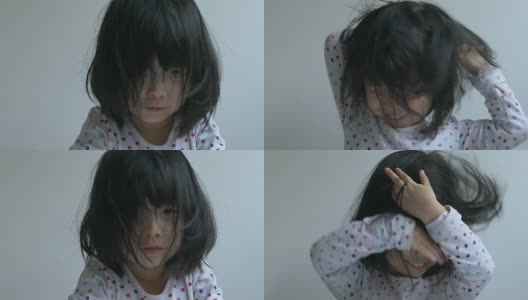 一个中国小女孩做鬼脸的慢镜头特写高清在线视频素材下载