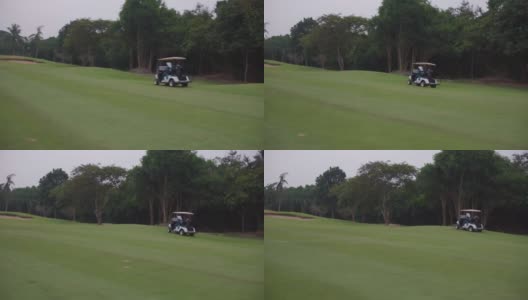 高尔夫球手开车穿过高尔夫球场。高清在线视频素材下载