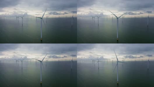 鸟瞰图。巨大的风车矗立在荷兰伊塞米尔河畔的海上高清在线视频素材下载