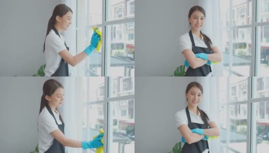 亚洲清洁服务女工在客厅工作的肖像。美丽的女孩，家庭主妇，管家，清洁工感到高兴，擦窗户为家务或家务然后看着相机高清在线视频素材下载