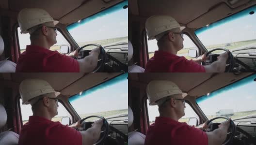 一名戴着施工头盔和太阳镜的男子在高速公路上快速驾车高清在线视频素材下载