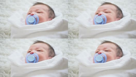 可爱的亚洲宝宝和奶嘴高清在线视频素材下载