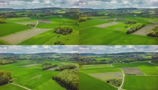 航拍的绿色田野和牧场在农村景观高清在线视频素材下载