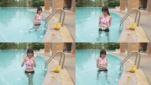 女人放松和享受在游泳池高清在线视频素材下载