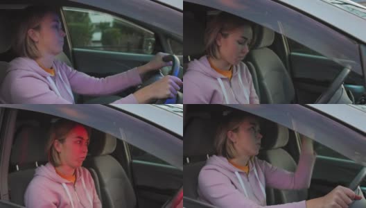 一名年轻的白人女子紧张地坐在右驾驶的驾驶座上，向警察提交文件。警笛灯在闪烁。交通违法罚款的概念高清在线视频素材下载
