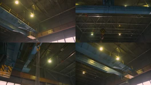 带吊钩的重型桥式起重机在工厂旁边移动高清在线视频素材下载