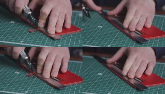 皮革厂的制革工人，为制作钱包的空白雕刻出一种特殊的图案高清在线视频素材下载