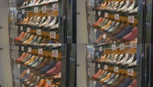 鞋店橱窗里的货架上摆放着各种颜色的经典皮革男鞋，上面还贴着价格标签高清在线视频素材下载