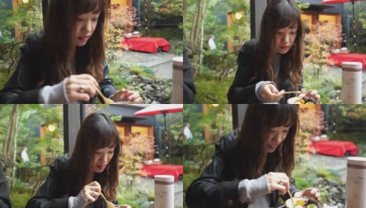 年轻女子吃“anmitsu”日本糖果高清在线视频素材下载