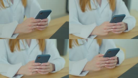 白大褂女医生使用现代智能手机触摸屏设备。医生使用手机向患者发送短信，告知医疗检查结果。高清在线视频素材下载