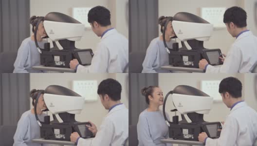 验光师在诊所检查病人的眼睛高清在线视频素材下载