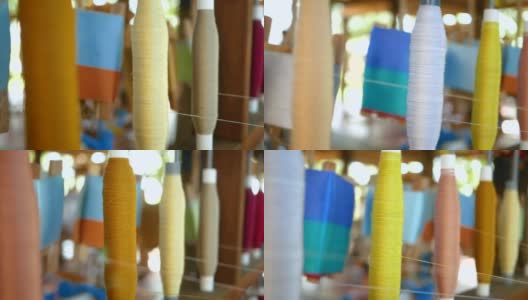 各种颜色的泰国生丝手工卷绕成卷。泰国北部地区的丝线和丝织品的产地。高清在线视频素材下载