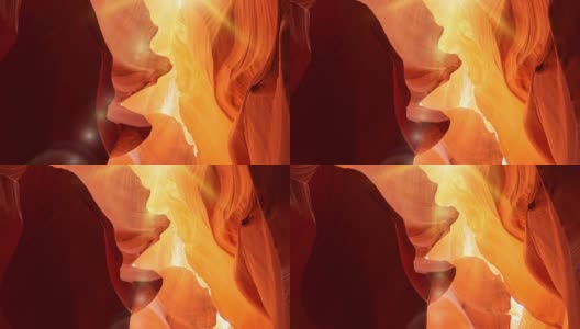 在美国亚利桑那州的羚羊峡谷，红色和橙色的墙壁。放大拍摄羚羊峡谷与光线的正午太阳和眩光高清在线视频素材下载