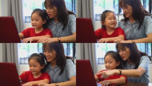 母亲和女儿在家里用笔记本电脑在线上课高清在线视频素材下载