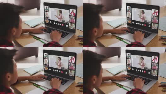 一个亚洲男孩在家里用笔记本电脑与老师和同学进行视频会议高清在线视频素材下载