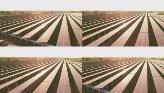 鸟瞰图太阳能电池板农场在夕阳下的农村农业农场，生产清洁电力高清在线视频素材下载