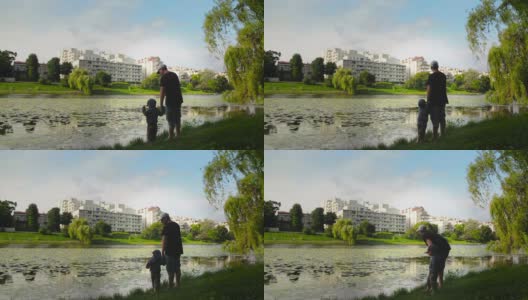 父亲和儿子在湖边高清在线视频素材下载