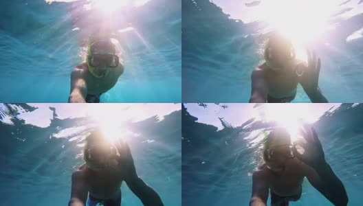年轻人在阳光下潜水高清在线视频素材下载