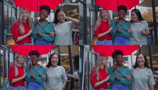 一个欢快的城市，多种族的女性朋友走在伞下的雨天在城市高清在线视频素材下载