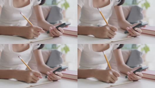亚洲女孩在家使用智能手机的手高清在线视频素材下载