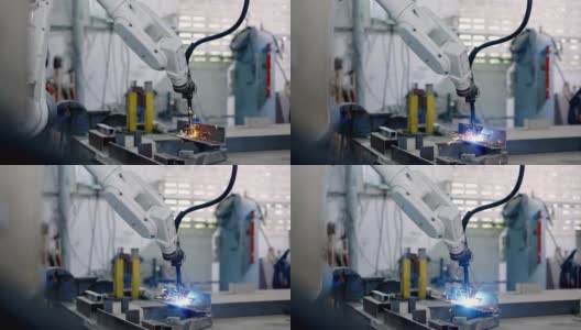 在一座旧工厂里，一个机器人用机械手臂焊接钢铁，并引起火灾。高清在线视频素材下载