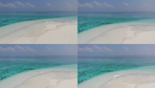 无人机在马尔代夫，印度洋，达拉万胡，碧水白沙的热带沙洲上空跟随一群白海鸥。珊瑚和鸟类的航拍影像。高清在线视频素材下载