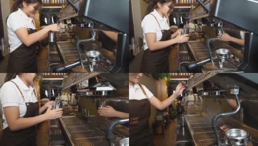 女咖啡师在咖啡厅用咖啡机流牛奶做特殊饮料高清在线视频素材下载